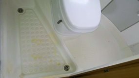 <strong>Before:</strong> Damaged shower tray